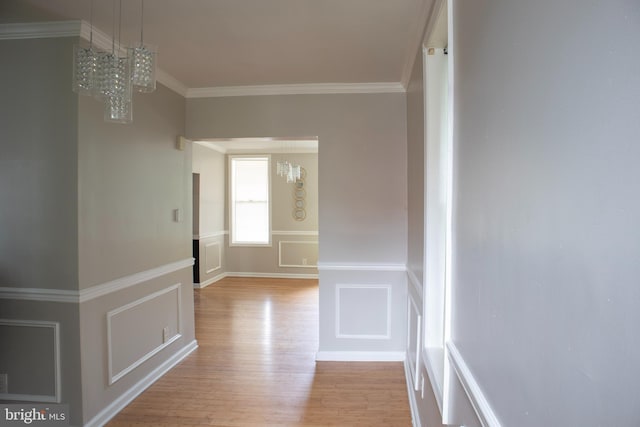 5519 Minnoka Ave, Baltimore, MD 21215 - hallway with a chandelier, light wood-style floors, and crown molding