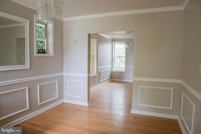 5519 Minnoka Ave, Baltimore, MD 21215 - corridor with a chandelier, wood finished floors, a decorative wall, crown molding, and wainscoting