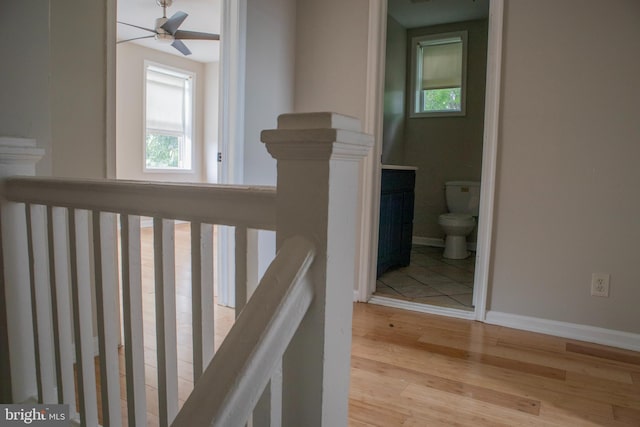 5519 Minnoka Ave, Baltimore, MD 21215 - stairs featuring wood finished floors, plenty of natural light, ceiling fan, and baseboards
