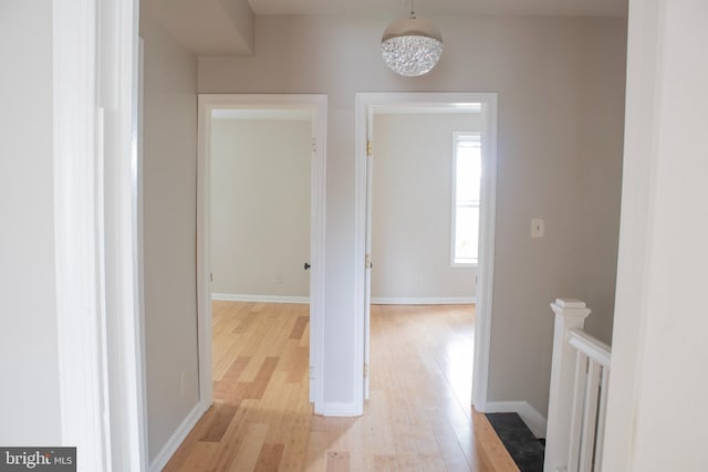 5519 Minnoka Ave, Baltimore, MD 21215 - hall featuring light wood-style floors, baseboards, and an upstairs landing