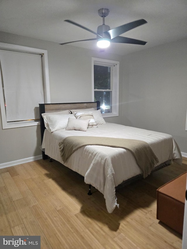 5519 Minnoka Ave, Baltimore, MD 21215 - bedroom with light wood-style flooring, baseboards, and a ceiling fan