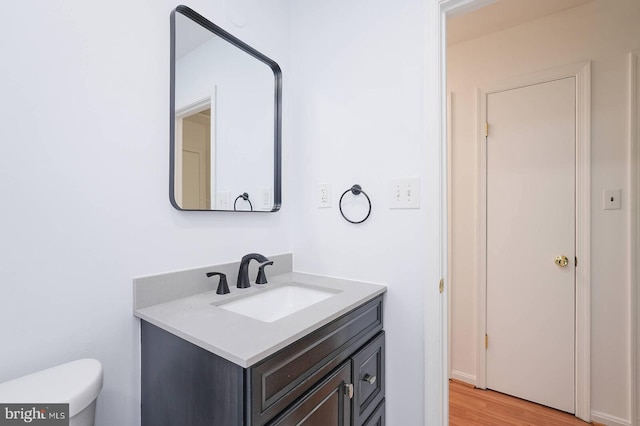 2012 All Hallows Ct, Waldorf, MD 20602 - bathroom with vanity, toilet, and wood finished floors