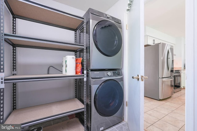 2012 All Hallows Ct, Waldorf, MD 20602 - laundry area with stacked washer / dryer and light tile patterned flooring