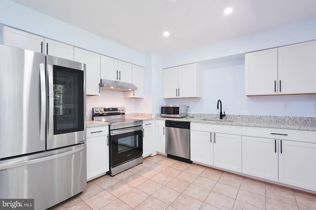 2012 All Hallows Ct, Waldorf, MD 20602 - kitchen with stainless steel appliances, under cabinet range hood, a sink, white cabinets, and light stone counters
