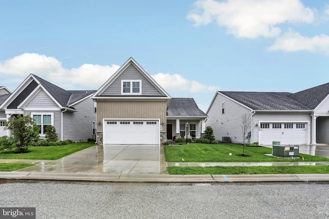view of front facade featuring concrete driveway, a front lawn, stone siding, central air condition unit, and an attached garage