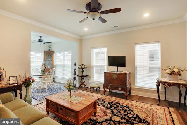 living room featuring a ceiling fan, crown molding, wood finished floors, recessed lighting, and baseboards