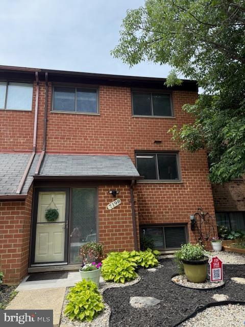 view of front of house featuring brick siding