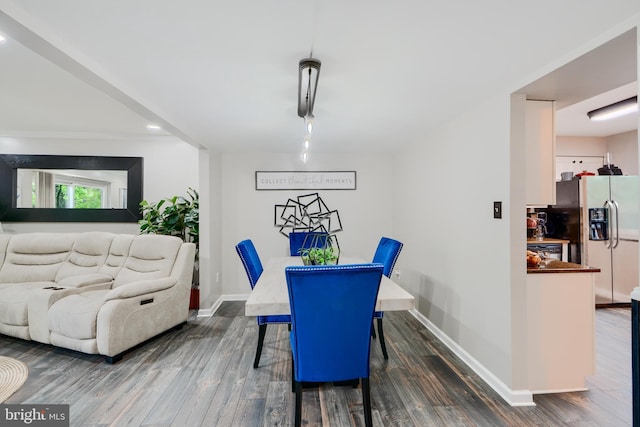 dining area with wood finished floors, baseboards, and recessed lighting