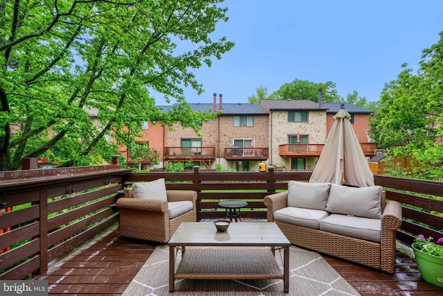 wooden terrace featuring an outdoor hangout area
