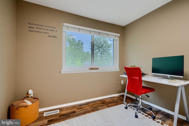 office space with wood finished floors and baseboards