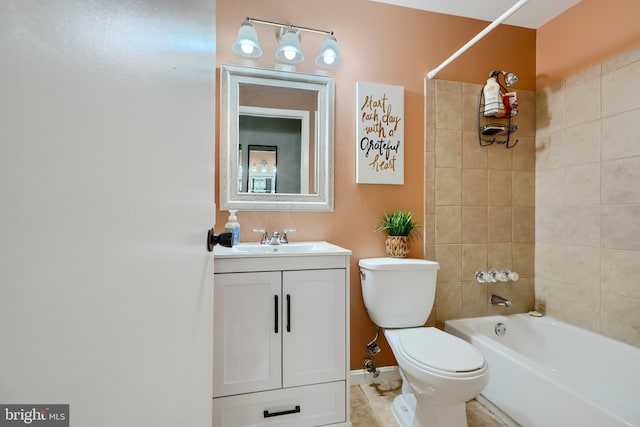 bathroom featuring toilet, vanity, shower / washtub combination, tile patterned flooring, and baseboards
