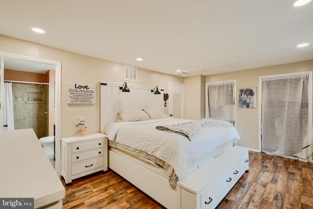 bedroom featuring attic access, dark wood-style flooring, recessed lighting, and connected bathroom