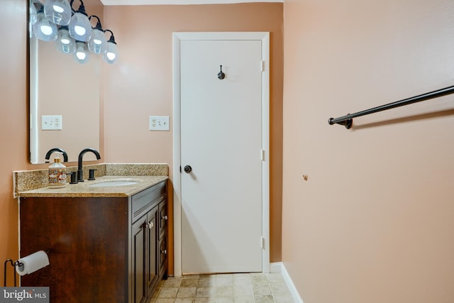 bathroom featuring vanity and baseboards
