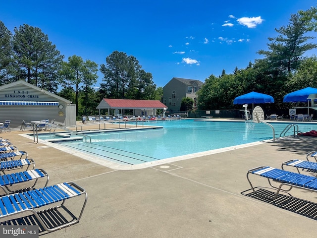 12821 Flagship Ave, Herndon, VA 20170 - community pool featuring a patio