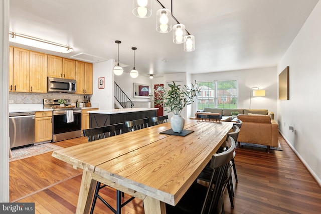 12821 Flagship Ave, Herndon, VA 20170 - dining area featuring wood-type flooring and stairway