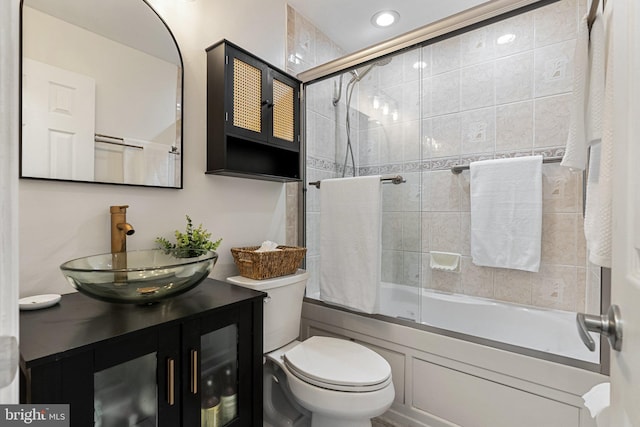 12821 Flagship Ave, Herndon, VA 20170 - bathroom with vanity, toilet, and combined bath / shower with glass door