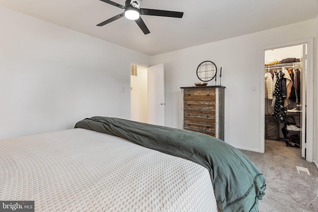 12821 Flagship Ave, Herndon, VA 20170 - bedroom with carpet floors, a walk in closet, a closet, baseboards, and a ceiling fan