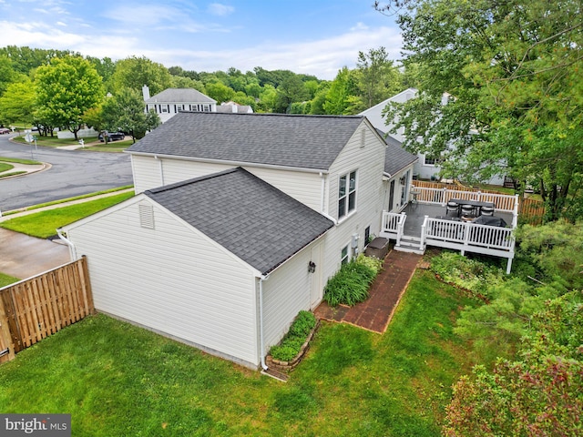12821 Flagship Ave, Herndon, VA 20170 - view of home's exterior with a shingled roof and a wooden deck