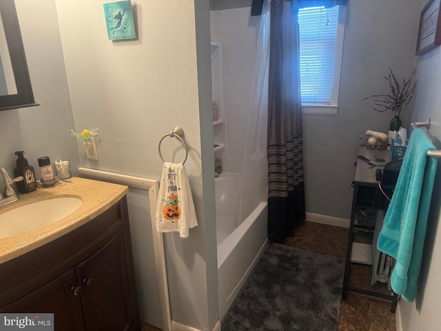 bathroom featuring vanity and shower / bath combination with curtain