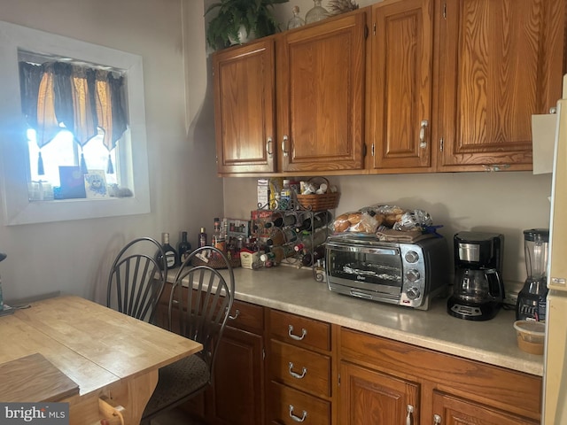 kitchen featuring brown cabinets