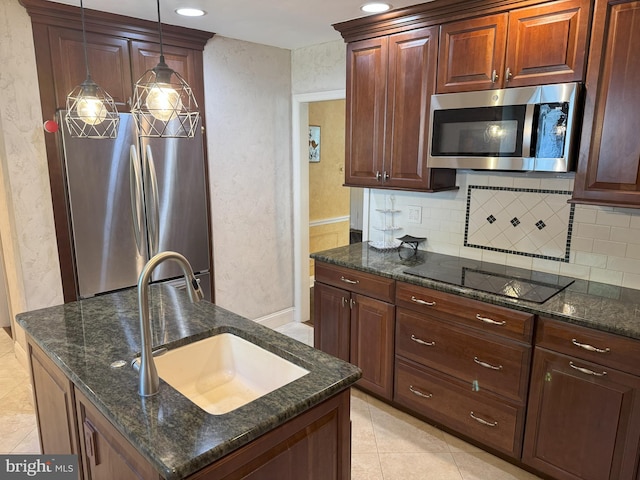 615 Bryn Mawr Ave, Penn Valley, PA 19072 - kitchen featuring stainless steel appliances, a sink, tasteful backsplash, dark stone counters, and recessed lighting