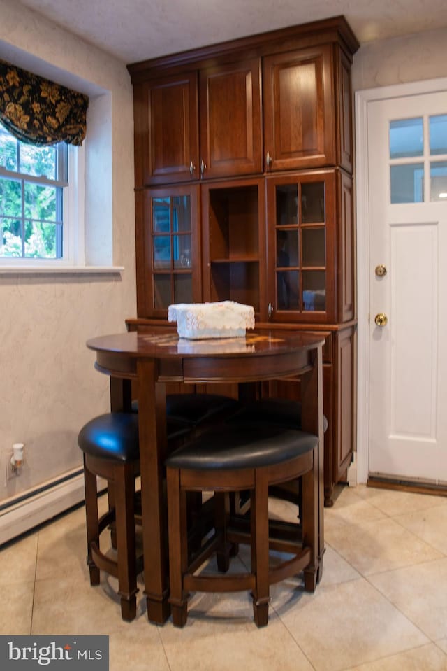 615 Bryn Mawr Ave, Penn Valley, PA 19072 - dining area featuring light tile patterned flooring and a baseboard heating unit