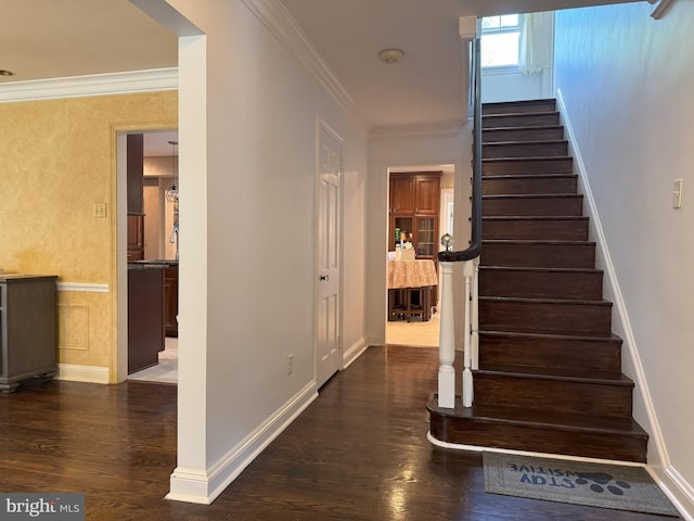 615 Bryn Mawr Ave, Penn Valley, PA 19072 - stairway featuring wood finished floors, crown molding, and baseboards