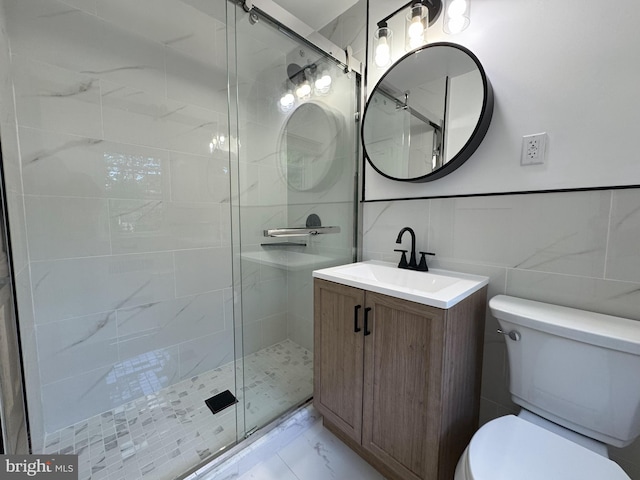 615 Bryn Mawr Ave, Penn Valley, PA 19072 - full bath featuring marble look tiles, toilet, a shower stall, tile walls, and vanity