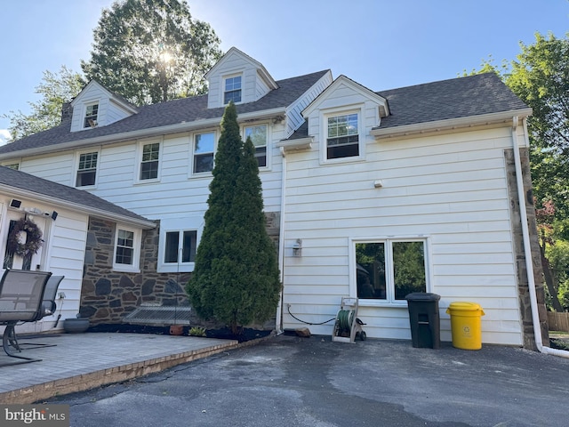 615 Bryn Mawr Ave, Penn Valley, PA 19072 - rear view of property with a patio, roof with shingles, and stone siding