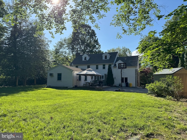 615 Bryn Mawr Ave, Penn Valley, PA 19072 - rear view of house featuring a gazebo, a storage shed, a patio, and a yard
