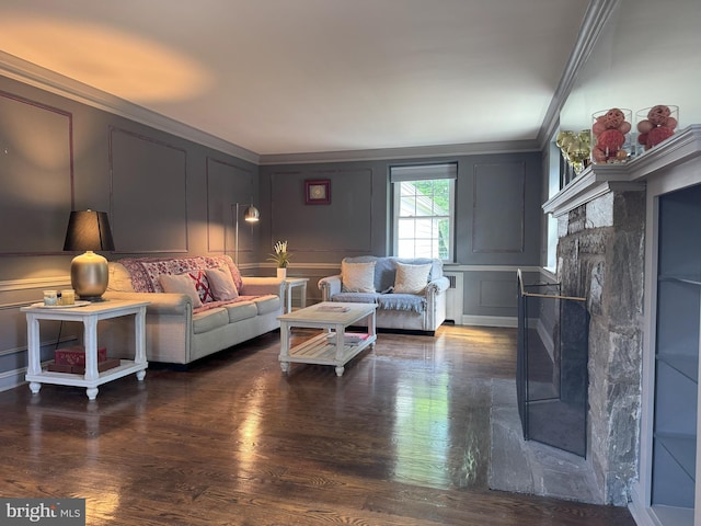 615 Bryn Mawr Ave, Penn Valley, PA 19072 - living area featuring a decorative wall, ornamental molding, wood finished floors, and a fireplace with flush hearth