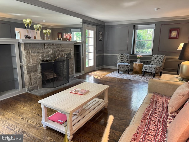 615 Bryn Mawr Ave, Penn Valley, PA 19072 - living area with a decorative wall, ornamental molding, wood finished floors, a fireplace, and radiator heating unit