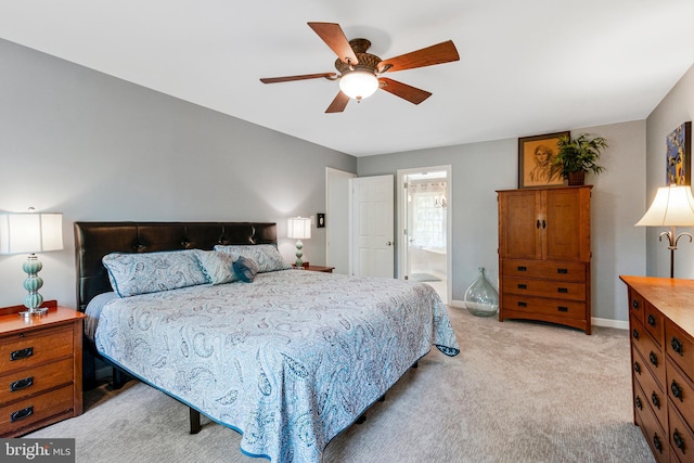 8412 Riverside Rd, Alexandria, VA 22308 - bedroom with light colored carpet, baseboards, ceiling fan, and ensuite bath