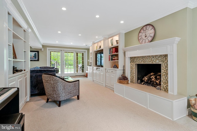 8412 Riverside Rd, Alexandria, VA 22308 - living room with crown molding, a tile fireplace, light colored carpet, recessed lighting, and built in shelves