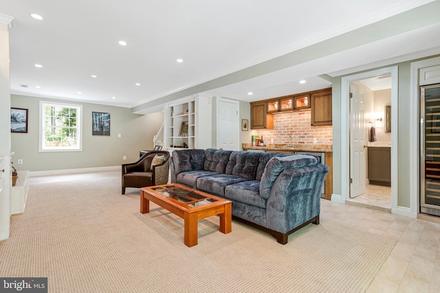 8412 Riverside Rd, Alexandria, VA 22308 - living room featuring crown molding, recessed lighting, baseboards, and bar area