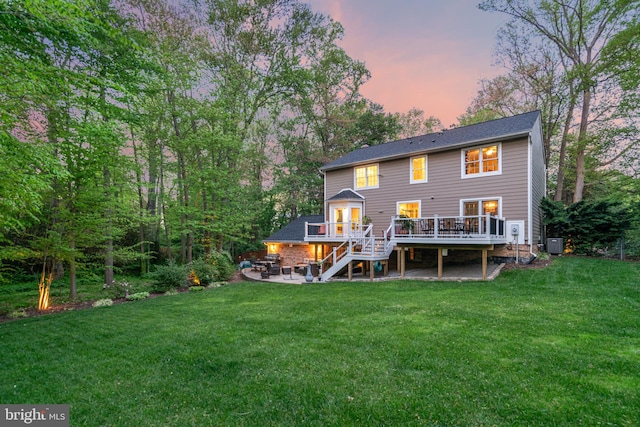 8412 Riverside Rd, Alexandria, VA 22308 - rear view of house with a wooden deck, stairway, a lawn, and a patio