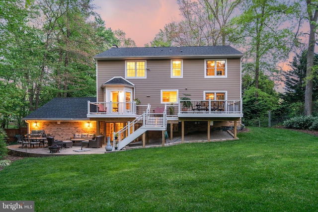8412 Riverside Rd, Alexandria, VA 22308 - back of house at dusk with outdoor lounge area, a wooden deck, stairs, a yard, and a patio