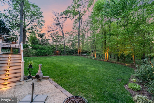 8412 Riverside Rd, Alexandria, VA 22308 - yard at dusk featuring stairway, a lawn, and a wooden deck