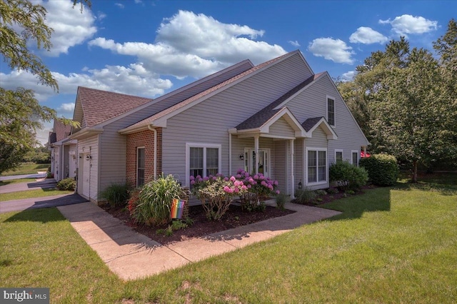 511 Abrams Ct, Bear, DE 19701 - view of front facade featuring an attached garage, a front yard, and roof with shingles