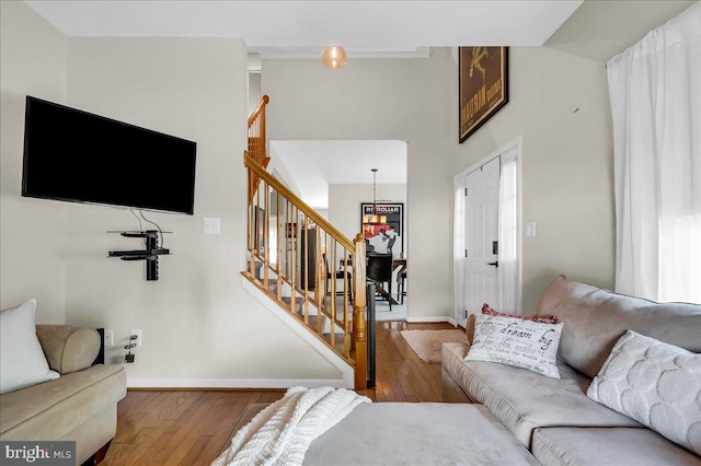 511 Abrams Ct, Bear, DE 19701 - living area featuring hardwood / wood-style flooring, stairs, baseboards, and a towering ceiling