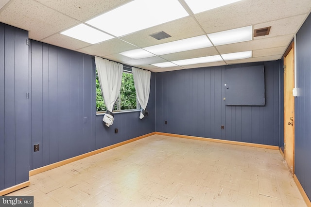 903 Burnt Crest Ln, Silver Spring, MD 20903 - spare room with a paneled ceiling, tile patterned floors, and baseboards