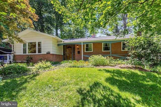 903 Burnt Crest Ln, Silver Spring, MD 20903 - view of front of property featuring brick siding, a front yard, and a chimney