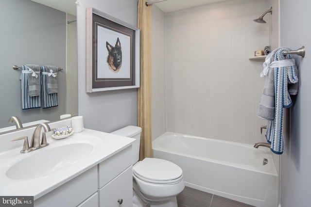 bathroom featuring toilet, shower / bathtub combination with curtain, and vanity
