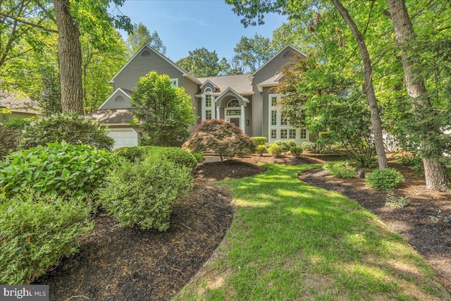 obstructed view of property featuring a garage