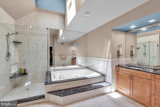 full bathroom with a shower stall, a bath, tile patterned floors, vanity, and recessed lighting