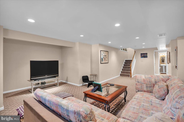 living area with carpet floors, baseboards, stairway, and recessed lighting