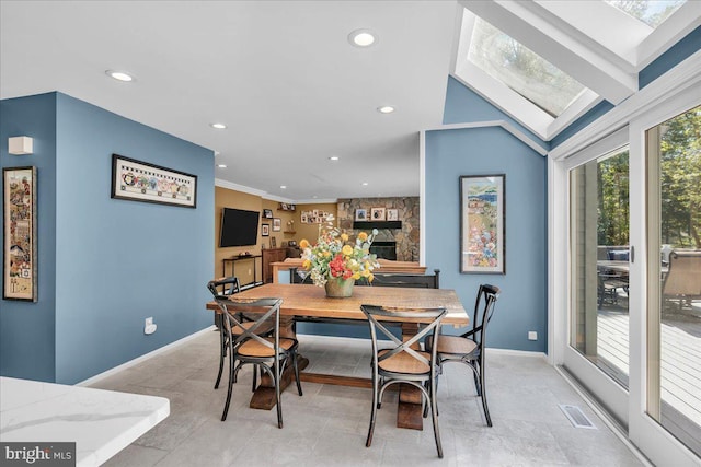 dining room with recessed lighting and baseboards