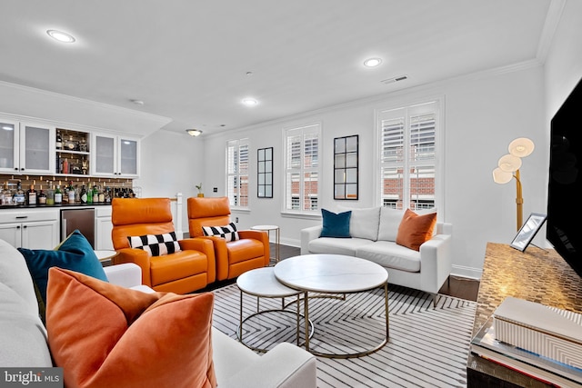 110 Commodore Ct, Philadelphia, PA 19146 - living area featuring a dry bar, baseboards, ornamental molding, recessed lighting, and wood finished floors