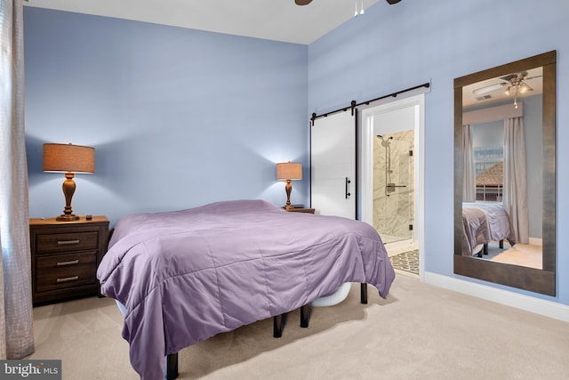 110 Commodore Ct, Philadelphia, PA 19146 - bedroom featuring a barn door, carpet flooring, baseboards, a ceiling fan, and ensuite bath