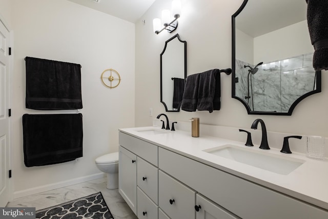 110 Commodore Ct, Philadelphia, PA 19146 - bathroom with marble finish flooring, baseboards, tiled shower, toilet, and double vanity